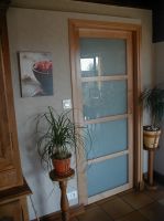 Porte coulissante vitrée
